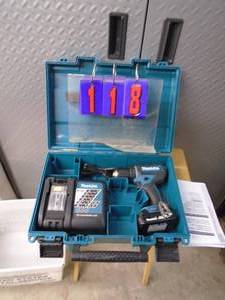 Makita 18 volt 38 drill with battery & charger. Looks nearly new. Tested & works. As shown.