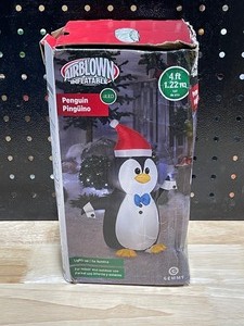 lot 20 image: 4 Foot Inflatable Penguin LED