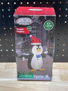 lot 21 image: 4 Foot Inflatable Penguin LED