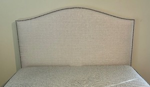 lot 11 image: Neutral Queen Bed Frame and  Fabric Headboard with Rivet Detailing