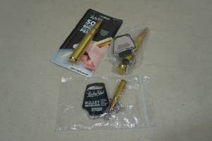 lot 86 image: Bullet Casing Pen, Keychain, and Necklace