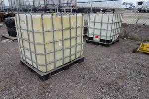 lot 912 image: 2 275 Gallon Plastic Tanks with Steel Pallets