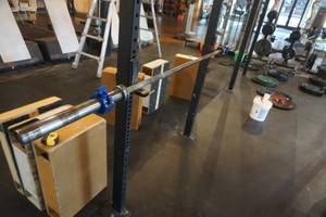 lot 303 image: Rogue Fitness Olympic Style Barbell With Clamps 87 Length