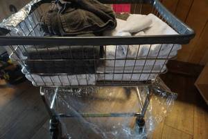 lot 568 image: Wheeled Wire Laundry Hamper With Laundered Towels