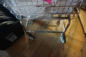 lot 569 image: Wheeled Wire Laundry Hamper With Laundered Towels