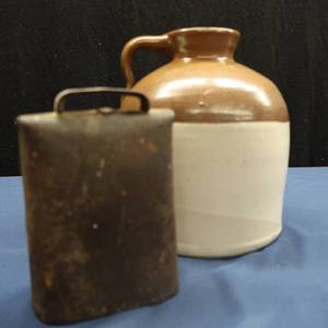 lot 41 image: VINTAGE COW BELL WITH A BROWN JUG