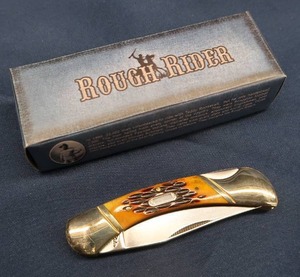 lot 87 image: AMBER STAG BONE LOCKBACK KNIFE