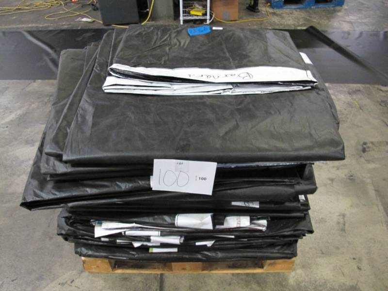 lot 100 image: Pallet of 25 Large Reused Lightweight PE Billboard Tarps