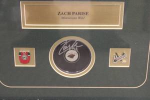 lot 75 image: Zach Parise Professionally Framed Autograph Puck w Photo  Pins