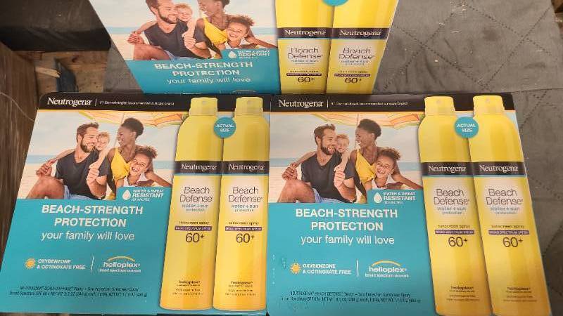 lot 564 image: 3 boxes of Neutrogena 60 SPF Beach Defense Spray on sunscreen lotion