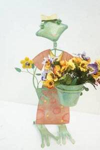 lot 11 image: Frog standing with flowers