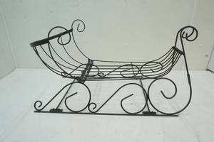 lot 28 image: Planter Box Shaped like a Sled