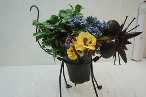 lot 33 image: Metal Art Cat plant holder, with flowers
