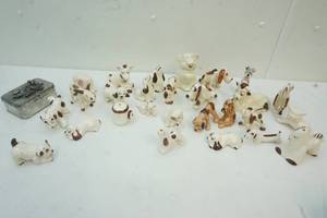 lot 91 image: Variety of Ceramic Dog Figures, cows,elephant