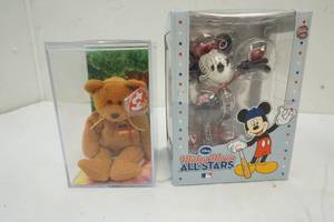 lot 218 image: Ty beanie in case and Mickey Mouse Mn Twins toy