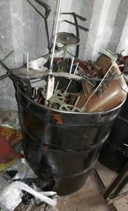 55 gal barrel full of commercial sewing machine parts