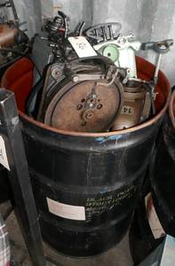 55 gal barrel full of commercial sewing machine parts