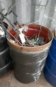 55 gal barrel full of commercial sewing machine parts