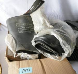 Box of 2 tire tubes and six  5 gallon pail covers