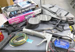 lot 63 image: Garage stuff - tow mirrors, outlet, caulk gun, stapler, trickle charger