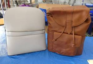 lot 89 image: One grey and one brown travel backpack