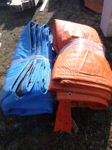 lot 82 image: 2 Large Foam Padded Plastic Tarps.