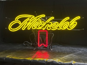 lot 53 image: Michelob script neon with red ribbon
