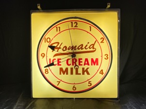 lot 90 image: Homaid Ice Cream and Milk fluorescent lit clock, works