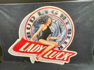lot 124 image: Bud Light Lady Luck tin tacker