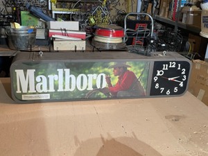 lot 94 image: Marlboro Cigarettes 2-sided display with clocks and ad panels