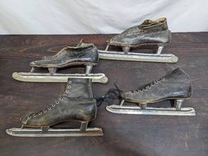 Two Pairs Of Old Ice Skates