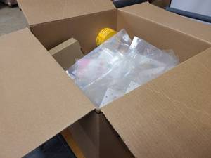 Box of various holiday and birthday decor