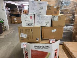 Large Pallet lot of previous unsold or unclaimed auction items