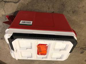 lot 45 image: Milwaukee PACKOUT 10 in. Red 16 qt. Compact Cooler    Customer Returns See Pictures