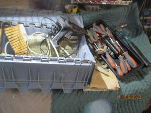 lot 63 image: Stowaway clamshell tote containing tools and supplies