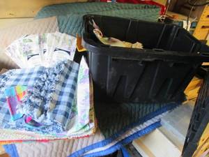 lot 307 image: Covered tote filled with placemats plus