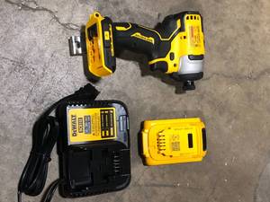 lot 35 image: DEWALT ATOMIC 20V Max Lithium-Ion Brushless Cordless Compact 14 in. Impact Driver Kit with 2.0Ah Battery, Charger and BagCustomer Returns See Pictures