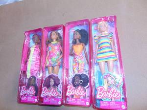 lot 87 image: 4 Pack Mixed Barbie