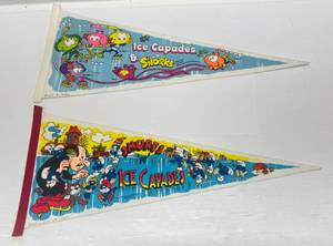 lot 281 image: Vintage 1980s Ice Capades Pennants Including Snorks, & Smurfs (Date Written On Bottom)