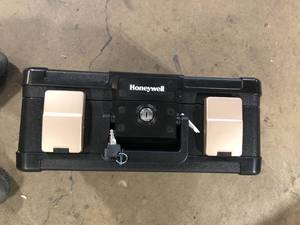 Honeywell 0.24 cu. ft. Molded Fire Resistant and Waterproof Portable Chest with Carry Handle, Key and Double Latch Lock Customer Returns See Pictures