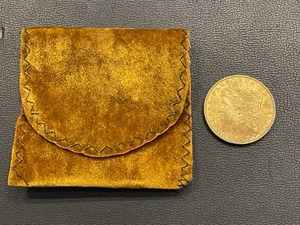lot 29 image: 1880-O Morgan Dollar and Coin Bag