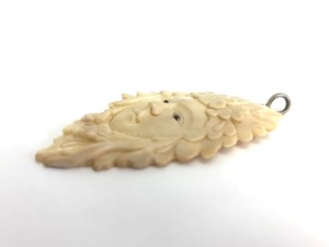 Hand Carved Bone Face Pendant - Woman w Flowers