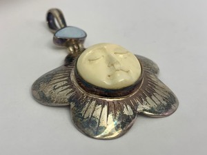 Sterling Silver &amp Carved Bone Sleeping Sun Face Pendant