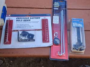 lot 495 image: Lot of (3) Assorted Battery Hold-Down Parts
