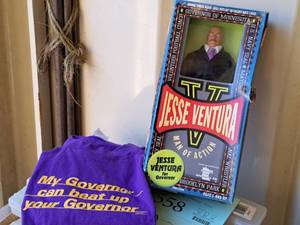 lot 557 image: Jesse Ventura Action Figure with (3) My Governor Can Beat Up Your Governor T-Shirts