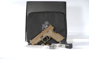 lot 61 image: 9mm Springfield, XDM, Elite OSP, Striker Fired, Semi-automatic, Polymer Frame Pistol, Full Size, 9MM, 4.5 Threaded Barrel, Polymer Frame, Cerakote Finish, Flat Dark Earth, Suppressor Height Sights, 22 Rounds, 2 Magazines