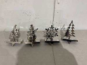 lot 33 image: SET OF 4 - Christmas Stocking Hangers - Silver