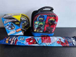 lot 144 image: Airhogs Gravitor Outdoor Toy, Spiderman Kite and Ninjago Lunchbox