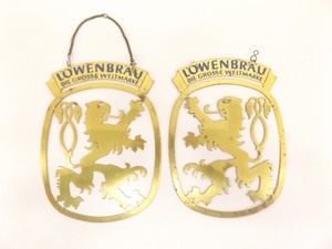 lot 33 image: 2 Vintage Brass Lwenbrau Wall Hangers
