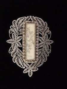 lot 62 image: Antique .925 Sterling Silver Inlayed Bone Carved Asian Inscribed Filigree Brooch